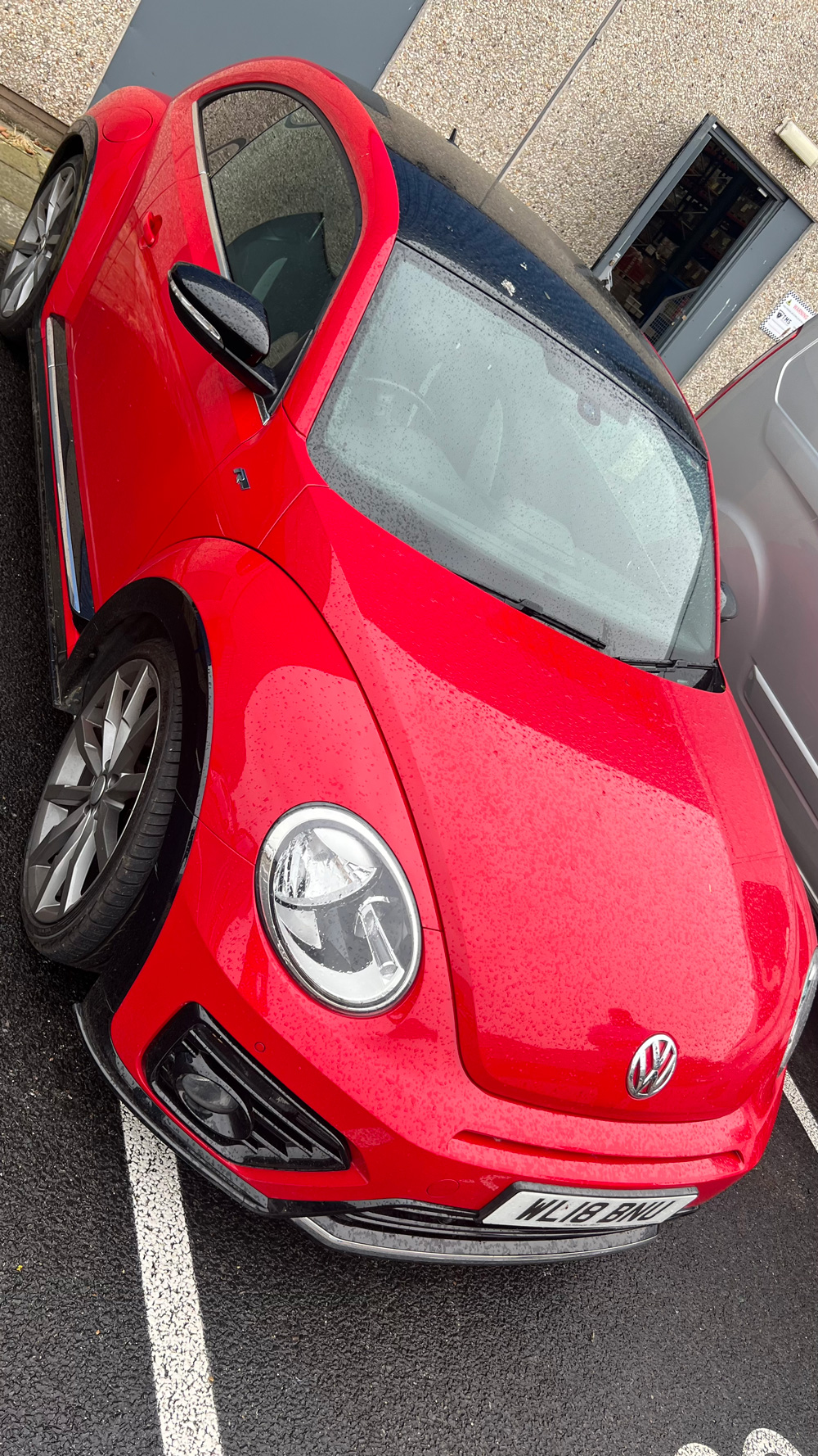 Red VW Beetle before its wrap
