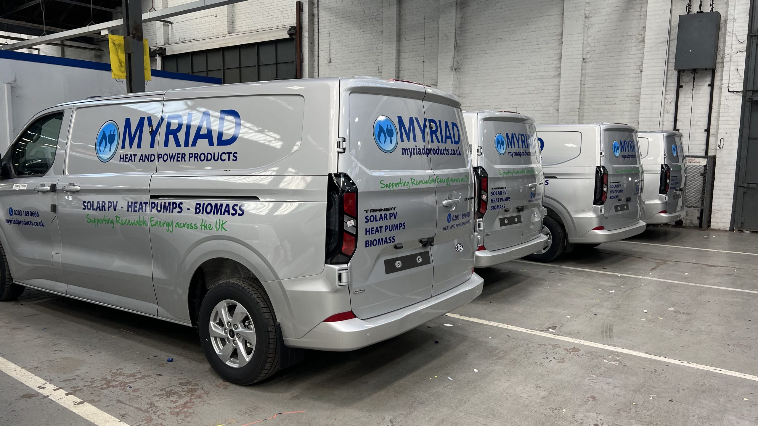 Fleet of Transit vans with graphics